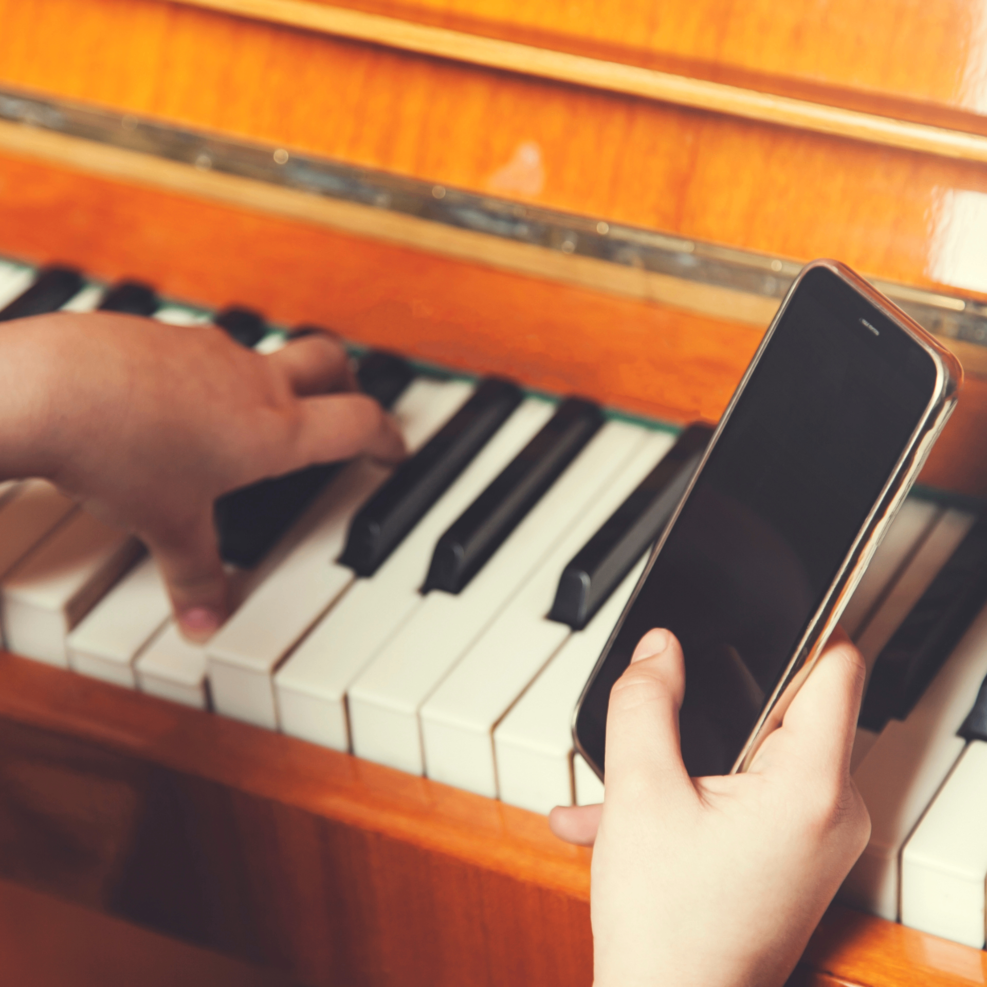 Musician interacting with a glowing waveform representing a real-time AI music tutor